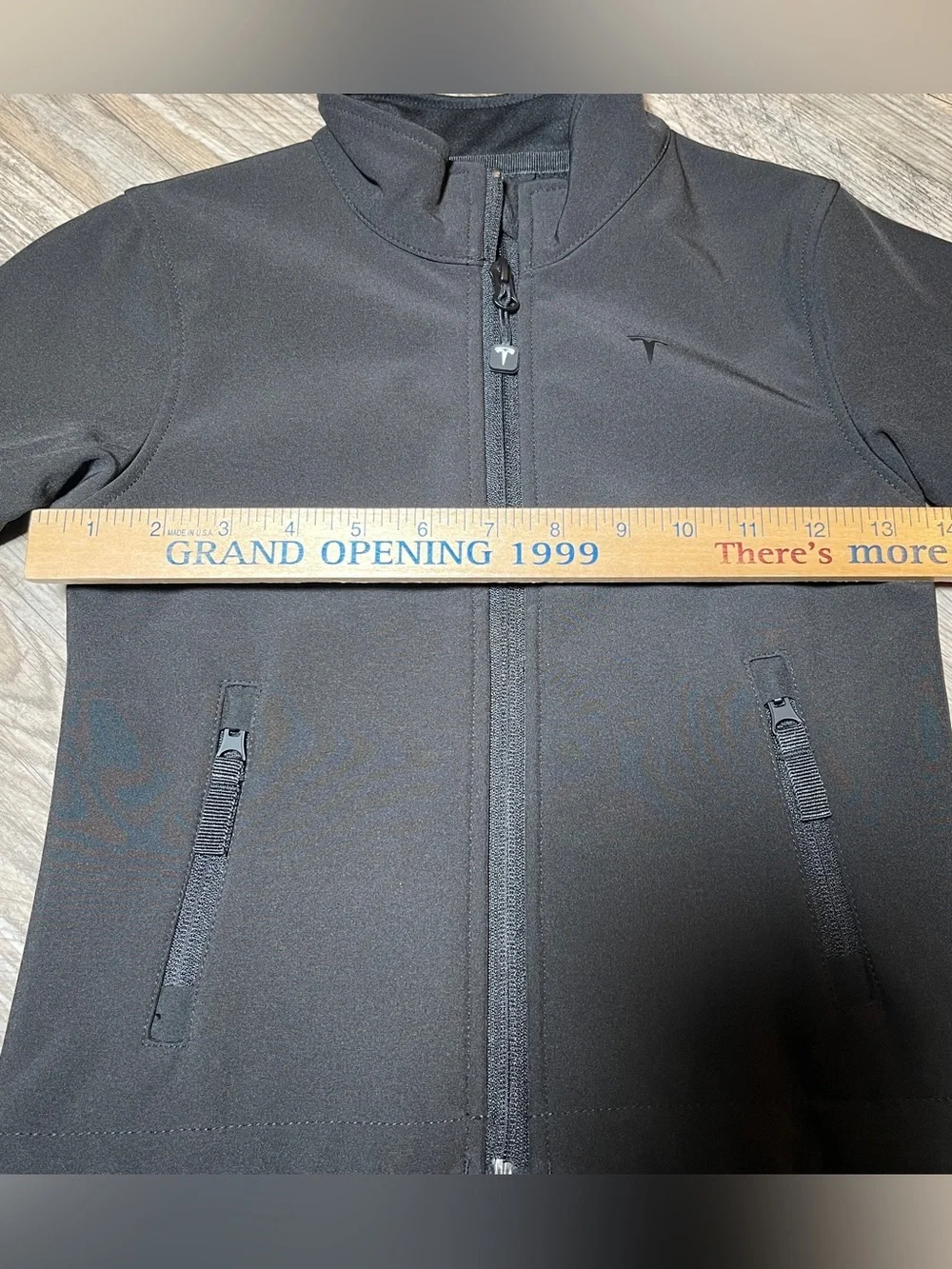 TESLA -The image features a Tesla Kids Corporate Softshell Jacket, black
